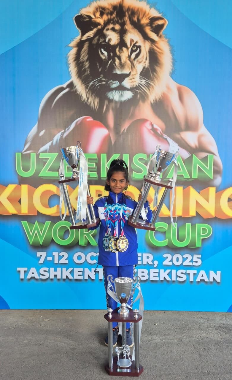 Rakshathra holding three trophies at the Uzbekistan Kickboxing World Cup, Tashkent, October 2025