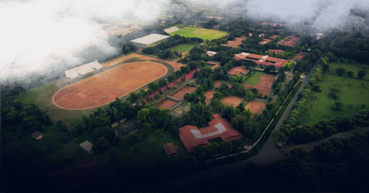 Aerial view of the Mathakondapalli Model School campus, with its sports ground, buildings and green cover