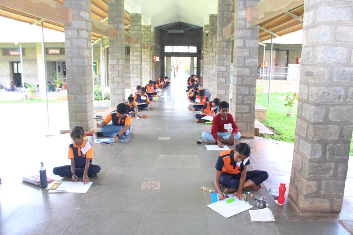Students spread across the corridor working on mural and craft projects