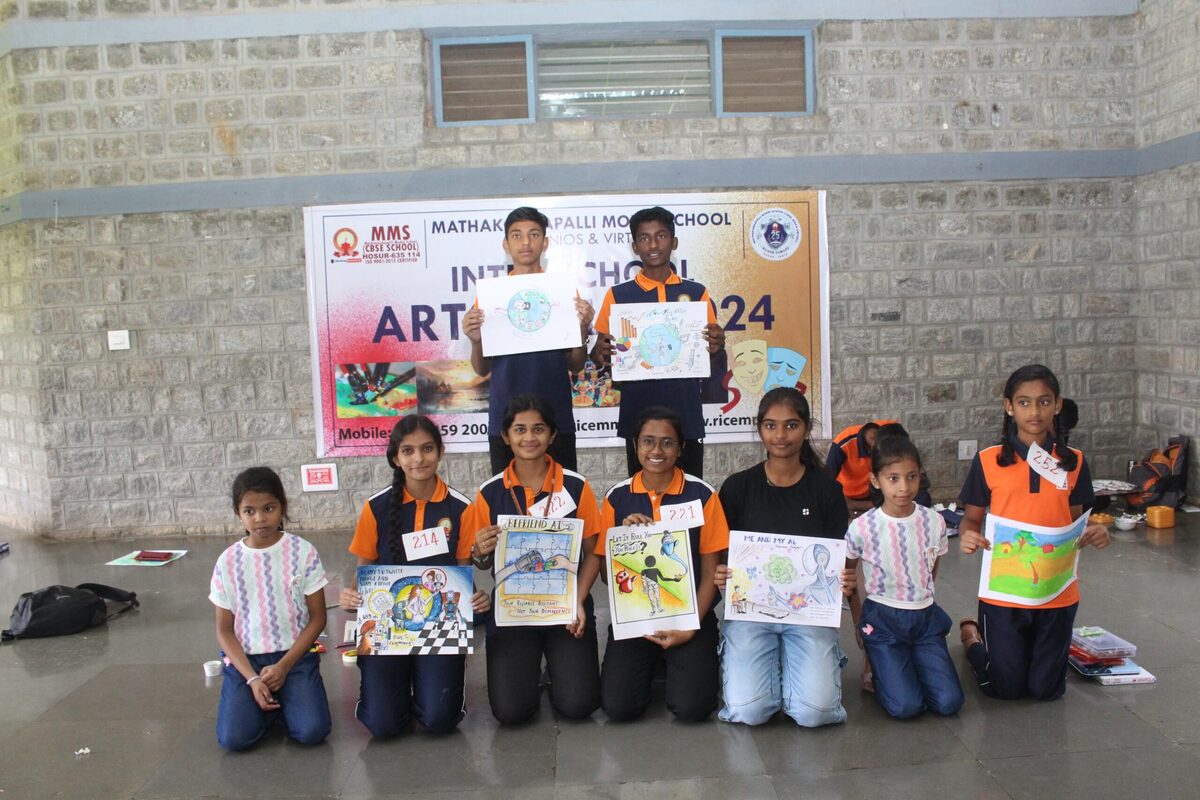Winners of an inter-school art competition posing with their artworks