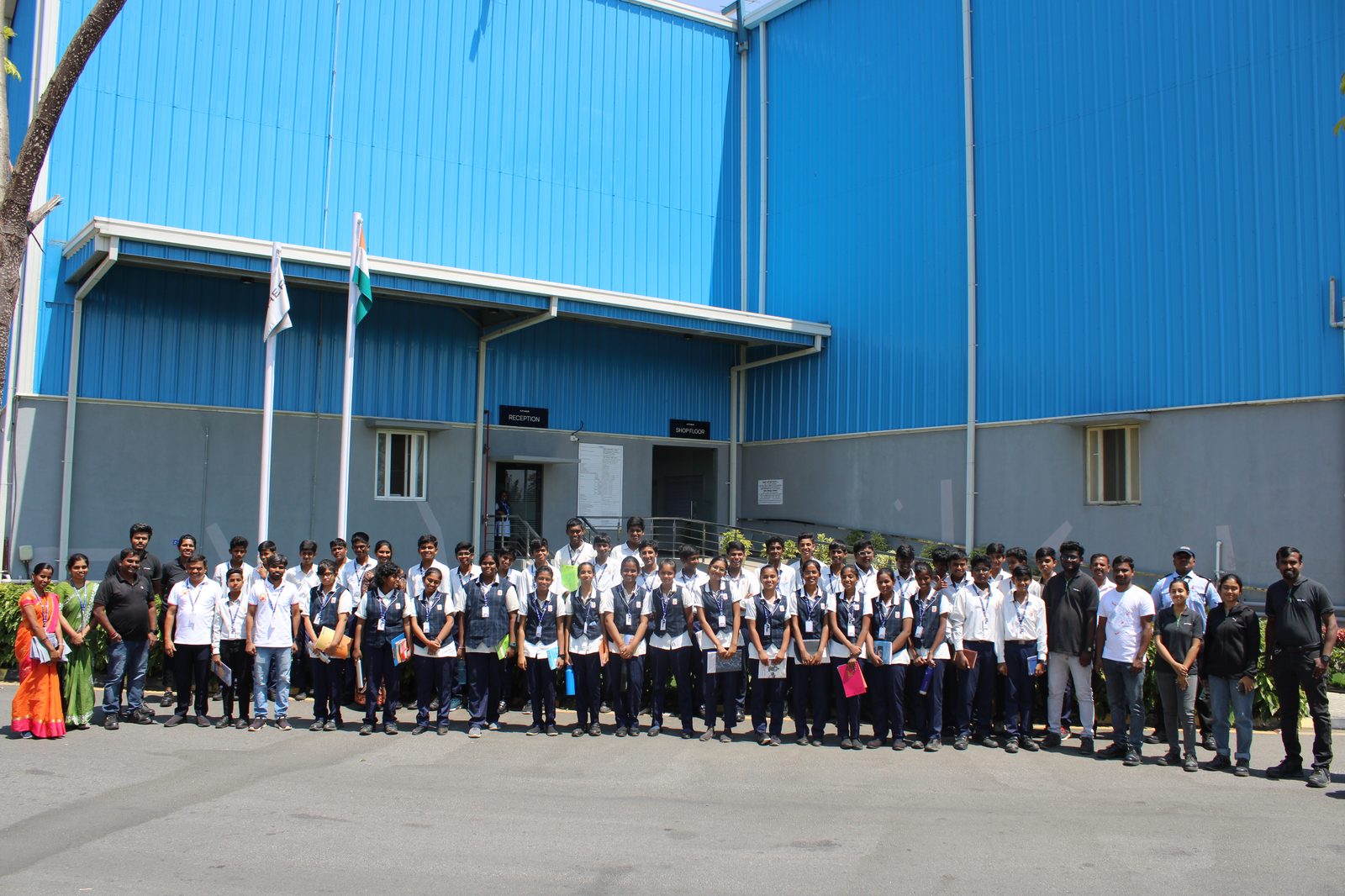 MMS teachers and Class 9 students outside the Ather Energy Ltd facility