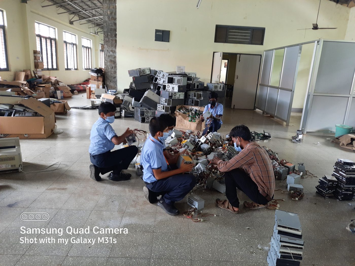 Students salvaging components from computer power supplies
