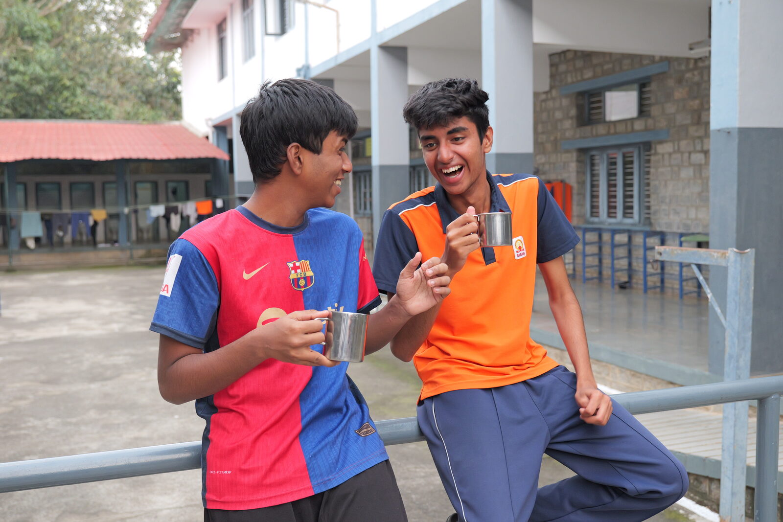Two boarders sharing a laugh over tea
