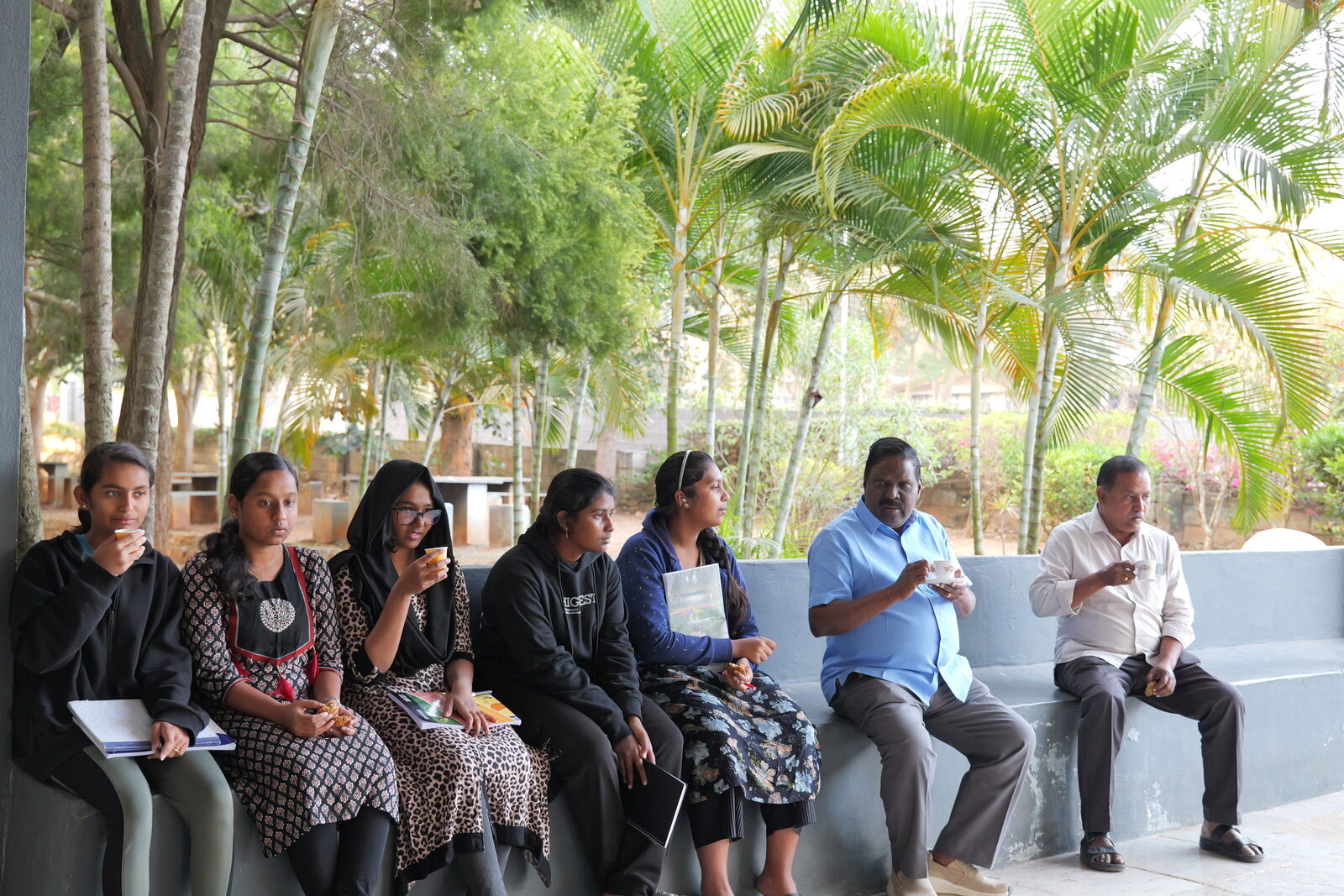 Students and staff at a hostel tea time gathering