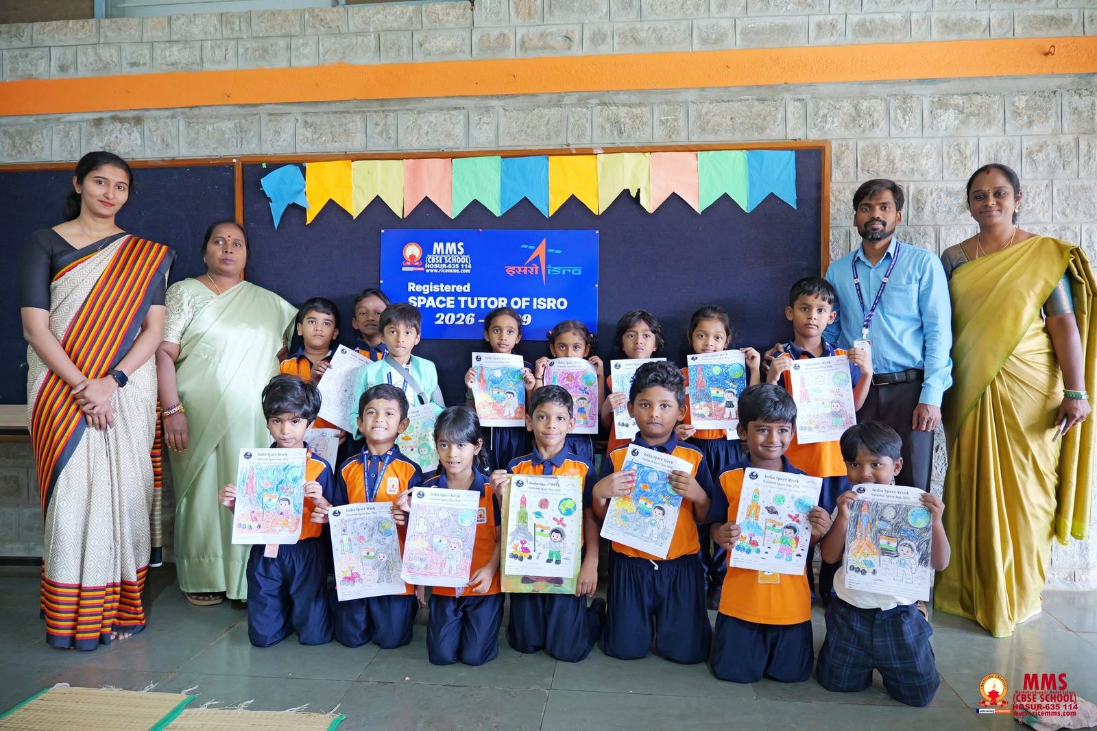 MMS faculty and students with their finished India Space Week colouring sheets