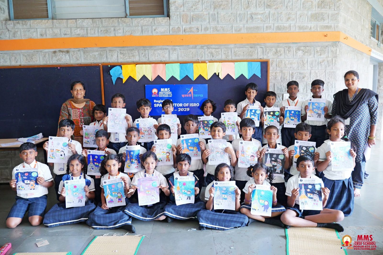 A full class with their India Space Week colouring sheets