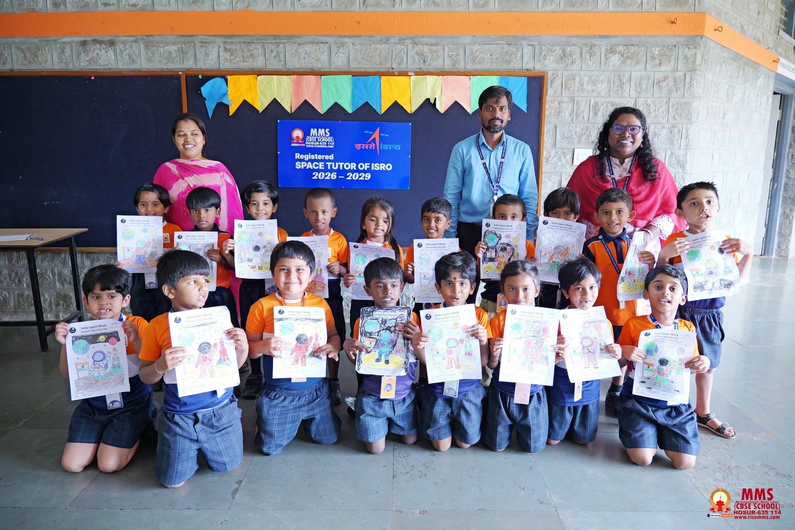 Senior students showing their India Space Week colouring sheets