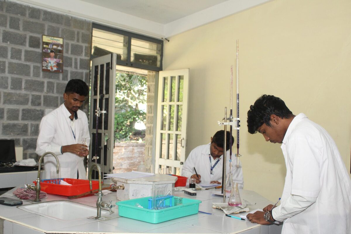 A student conducting a titration experiment under staff guidance
