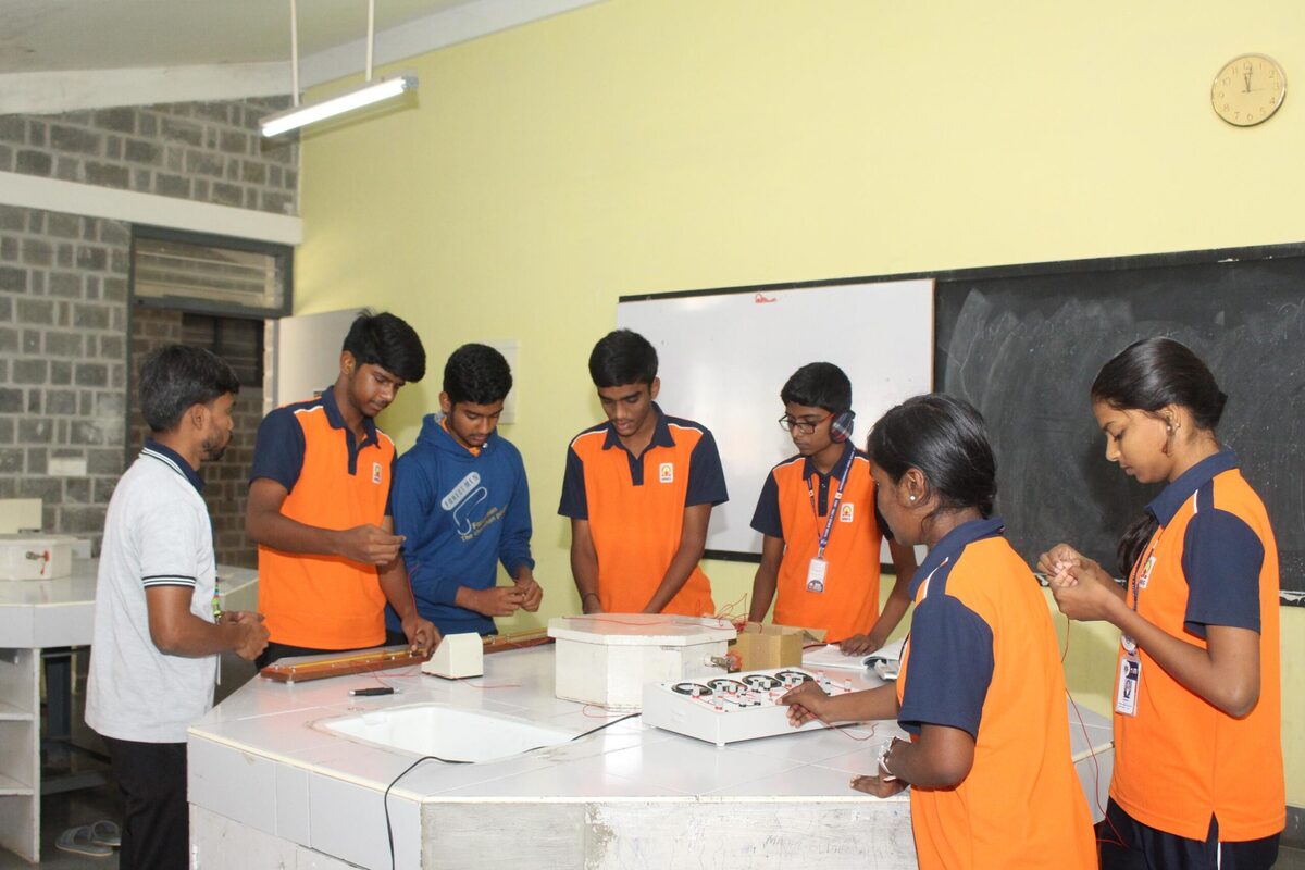 A group of students works through a shared physics experiment