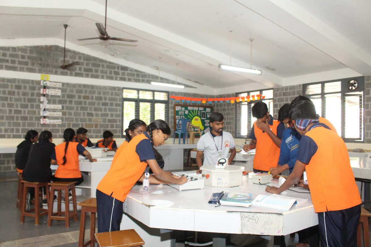 Students noting down readings during a resistance and circuit experiment
