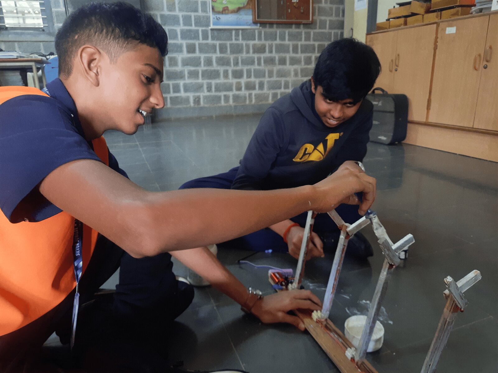 Students building the wooden Y-shaped frame for one of the LED highway signal posts