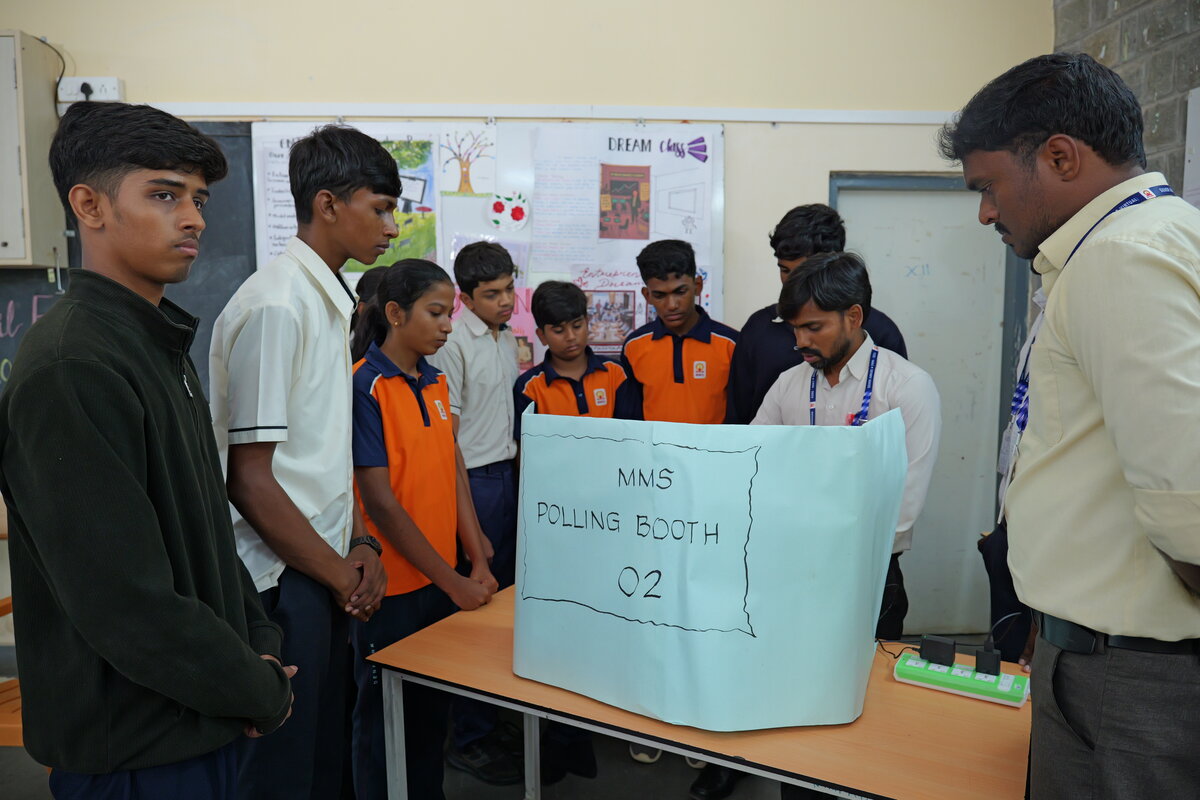 Teachers reviewing the final results together