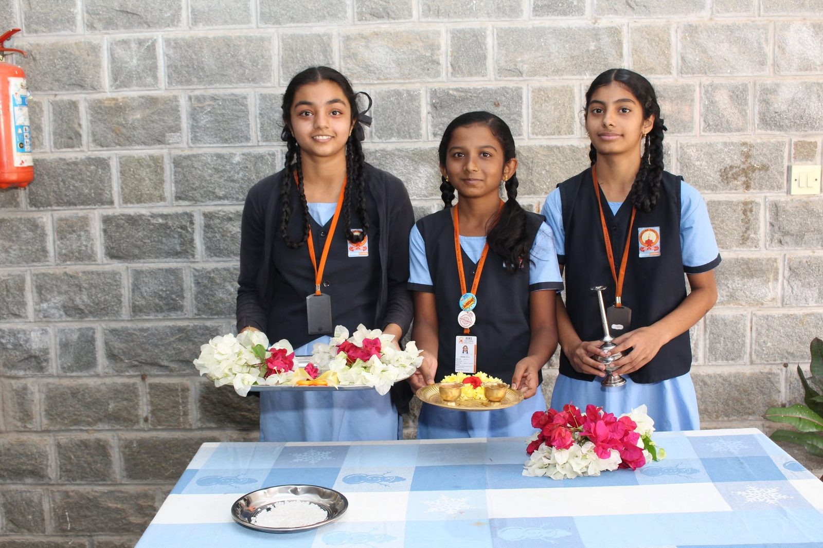 Students holding the ceremonial thali for the inauguration ritual
