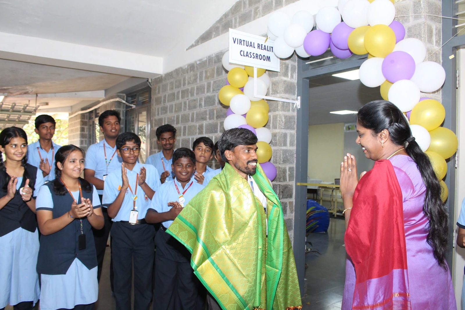 Ribbon cutting at the entrance to the newly named Virtual Reality Classroom